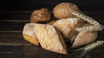 bread and wheat on a wooden table photo