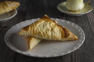 a plate with two triangles of pie on it photo