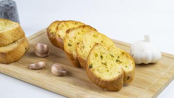 garlic bread with garlic and garlic on a cutting board photo