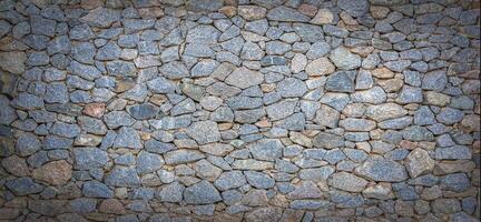 Texture of a stone wall. Old castle stone wall texture background. Stone wall as a background or texture. photo