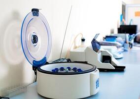 Modern electronic blood centrifuge in medical clinic.Selective focus. Equipment closeup. photo