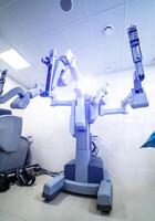 Surgical room in hospital with robotic technology equipment, machine in operation room. Minimal invasive surgical medical robot, surgery with robotic assisted surgeon. Closeup photo