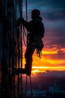 AI generated Industrial climber is rappelling from high industrial building at sunset. Silhouette of a man using ropes to work on the side of a wall photo