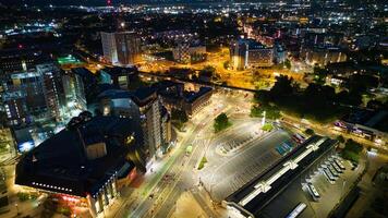 Aerial night view of a bustling cityscape with illuminated streets and urban architecture in Leeds. photo