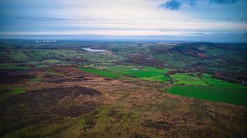 Aerial view of the farm land and forest in the countryside of england photo