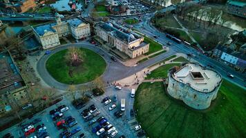 Aerial view of a historic cityscape with a roundabout, ancient buildings, and a fortress at dusk in York, North Yorkshire photo