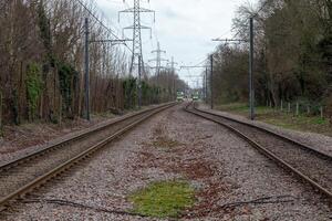 a train track with two tracks and a train photo