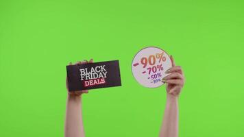 Black Friday Deals and purchase discount percentage advertisement inscriptions on chroma key video