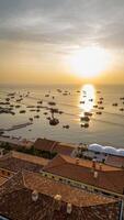 Picturesque view of fishing boats at sea on Phu Quoc Island at sunset, Vietnam photo