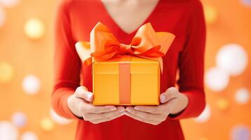 AI generated Woman's hands hold an orange gift box with a bow and ribbons on a colorful backdrop. Ai Generated photo