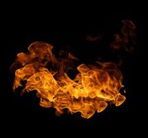 Fire and burning flame of explosive fireball isolated on dark background for abstract graphic design usage photo