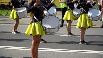 Ternopil, Ukraine July 31, 2020. Close-up of female hands drummers are knocking in the drum of their sticks. Majorettes in the parade video