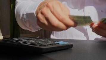 Man hands counting expenses banknotes of euro cash count on calculator. Close up of hands unrecognizable Businessman. Save up budget investment concept. Euros fund savings footage video