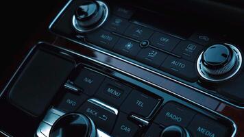 Interior of modern luxury car. Details of multimedia menu control system panel, dashboard inside. Prestige sport automobile. Selective focus video