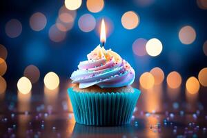 AI generated Candlelit delight Birthday cupcake with blue bokeh background photo