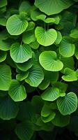 AI generated Botanical abundance Repeated pattern of vibrant green leaves background Vertical Mobile Wallpaper photo