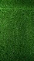 ai generado verde tono perfección fútbol campo con vibrante artificial césped textura vertical móvil fondo de pantalla foto