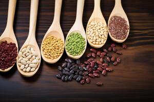 AI generated Natural ingredients Collection of beans and sesame on wooden spoons photo