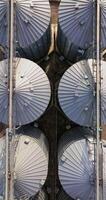 vertical aerial video over agro-industrial complex with silos and grain drying line