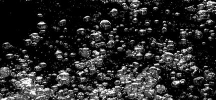 AI generated Soda water bubbles splashing underwater against black background. photo