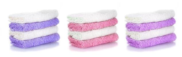 set of colored towels isolated on a white background photo
