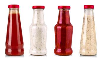 set of sauce bottles isolated on white background with clipping path photo