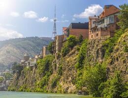 Houses on the edge of a cliff above the river Kura. Tbilisi, the historic city photo