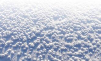 invierno nieve. nieve textura parte superior ver de el nieve. textura para diseño. Nevado blanco textura. foto