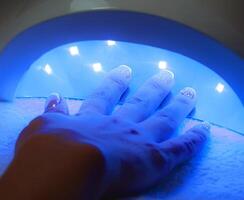 Drying in Nail enamel drying device. Selective focus photo