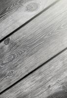 Old cracked paint on wooden planks. Selective focus photo