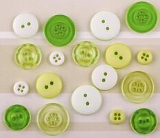 Colored buttons of different sizes on the surface photo