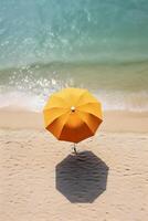 AI generated Yellow sunshade umbrella on an empty beach by the ocean. Aerial view. AI generated photo