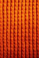 AI generated Close Up of Orange Knitted Material Texture. Generative AI photo