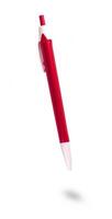 Red ballpoint pen isolated on white background photo