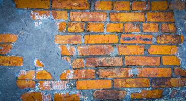 Colored wall of the house, the red brick wall of an abandoned house photo