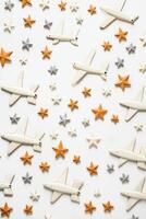 AI generated Airplane and stars shaped cookies on white background. Top view. AI generated photo