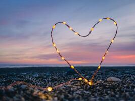 heart symbol with bright fairy lights photo