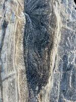 Light white rock texture. Mountain rough surface photo