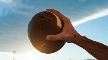 American football ball at sunset photo