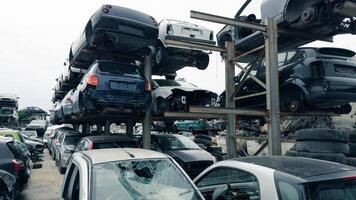 stacked scrap cars. recovery of car components photo