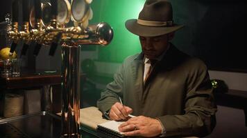 Detective with hat write on notebook photo