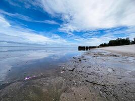 The view of the sea is beautiful, but unfortunately there is a lot of rubbish around the beach photo