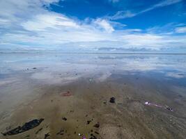 The view of the sea is beautiful, but unfortunately there is a lot of rubbish around the beach photo