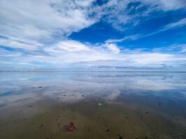 The view of the sea is beautiful, but unfortunately there is a lot of rubbish around the beach photo