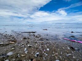 The view of the sea is beautiful, but unfortunately there is a lot of rubbish around the beach photo