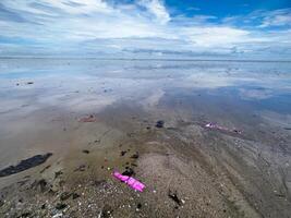 The view of the sea is beautiful, but unfortunately there is a lot of rubbish around the beach photo