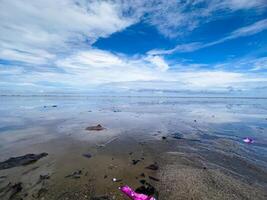 The view of the sea is beautiful, but unfortunately there is a lot of rubbish around the beach photo