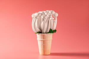 shimeji mushrooms with green moss in green ice cream cone, on pink background photo