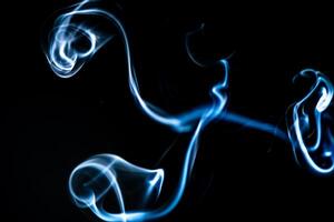 blue smoke, vapor, fog cloud on black background for using in composition and overlay photo