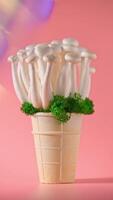 shimeji mushrooms with green moss in green ice cream cone, on pink background photo